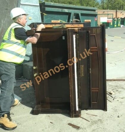 Unloading a piano at a licensed waste disposal facility. Unloading a piano at a licensed waste disposal facility.