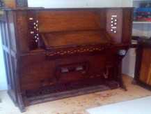 Image of a reed organ moved by SW Piano Movers